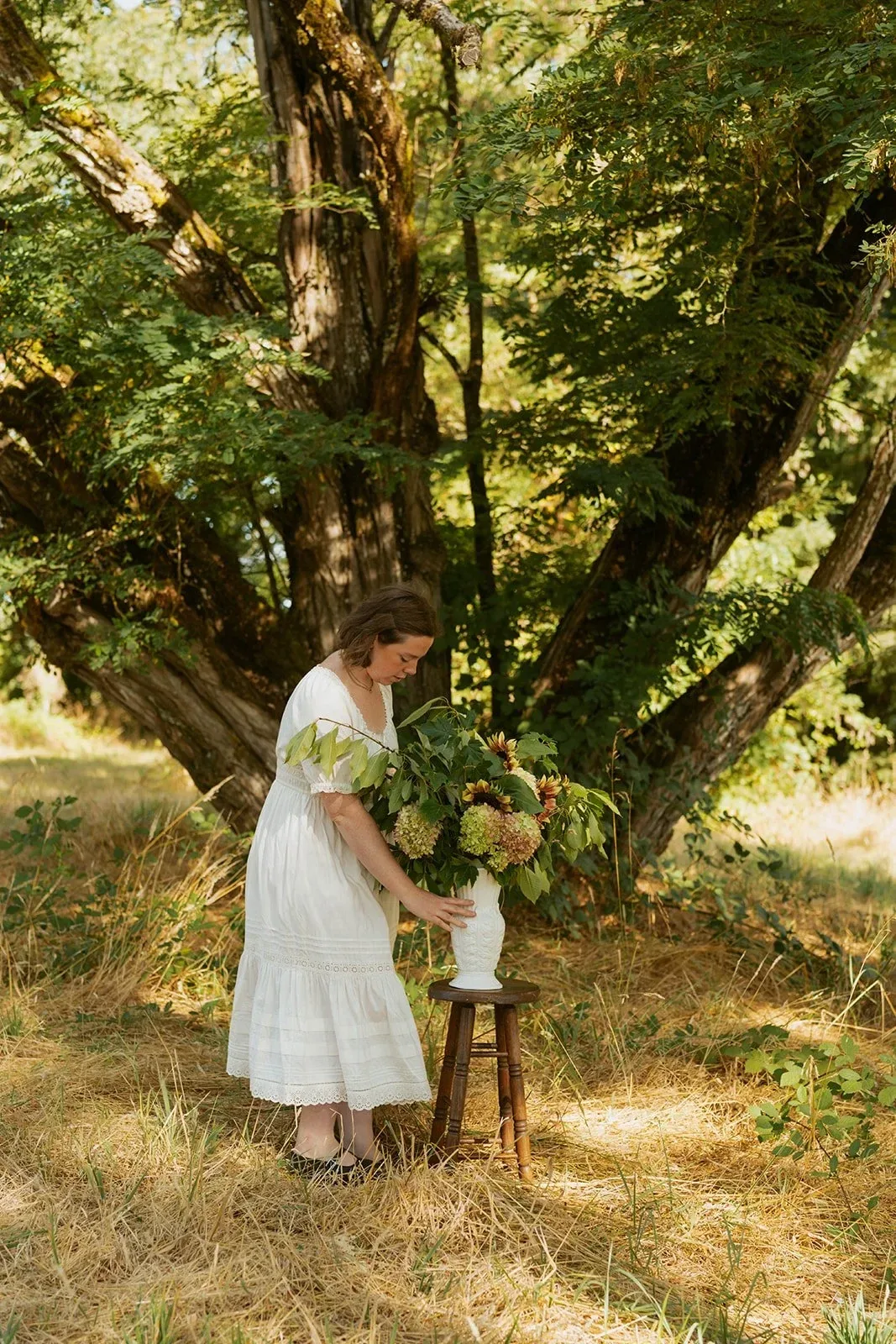 A quiet moment among wildflowers and gathered greenery